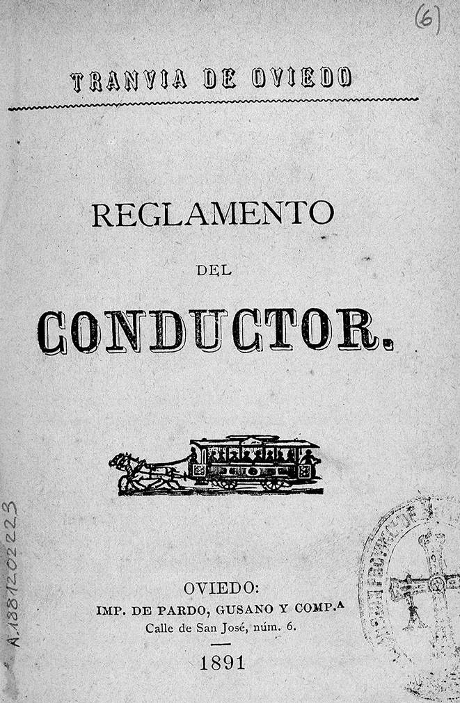 Altes Buch mit dem Titel 'Reglamento de Conductor' mit einer Zeichnung eines Zuges auf dem Cover und einem Stempel auf der rechten Seite.