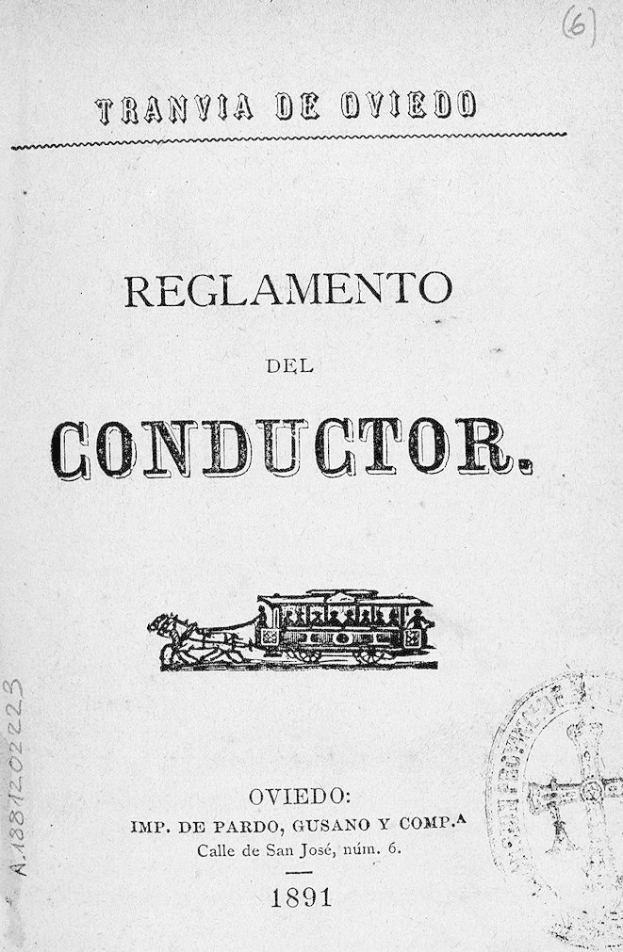 Altes Buch mit dem Titel 'Reglamento de Conductor' mit einer Zeichnung eines Zuges auf dem Cover und einem Stempel auf der rechten Seite.