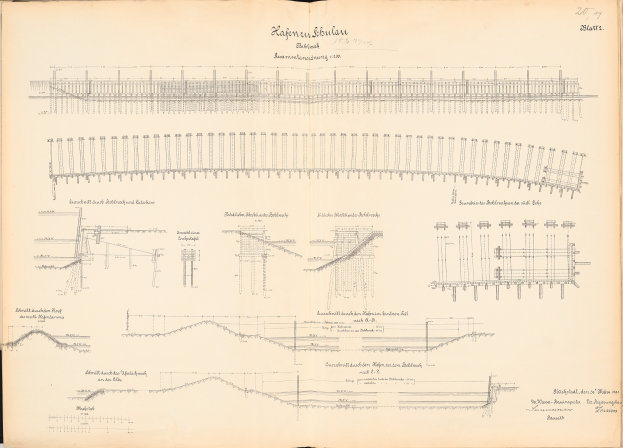 Offenes Buch mit detaillierten Zeichnungen und Texten, einschließlich einer Eisenbahnschienen-Illustration, das einen umfassenden Überblick über ein Schienensystem gibt.